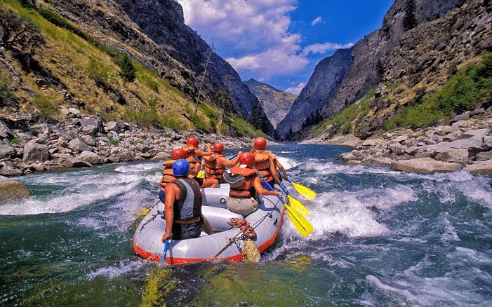 Group river rafting through the Beas River